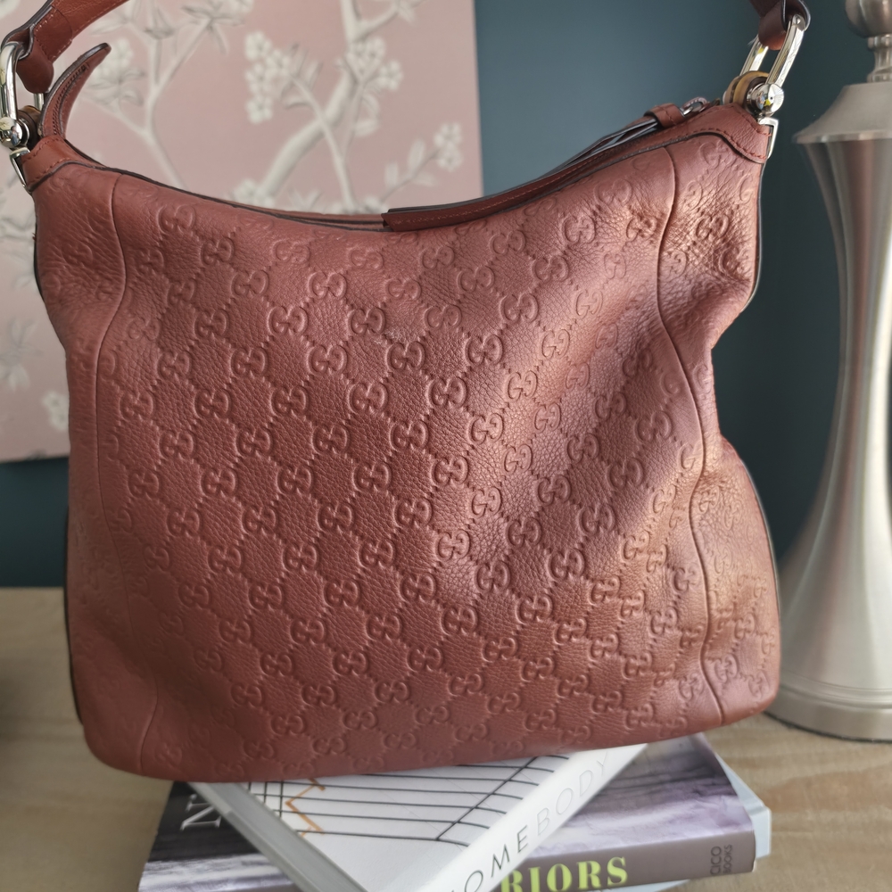 Gucci Embossed Leather Hobo Bag in Brown